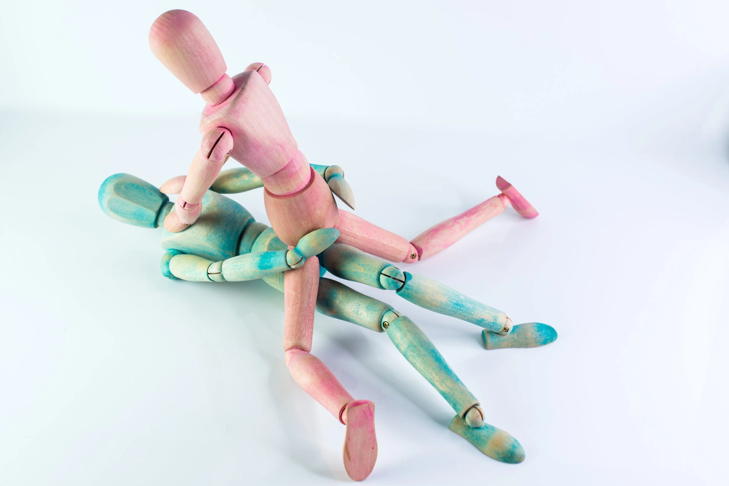 wooden dolls simulating sex with female on top