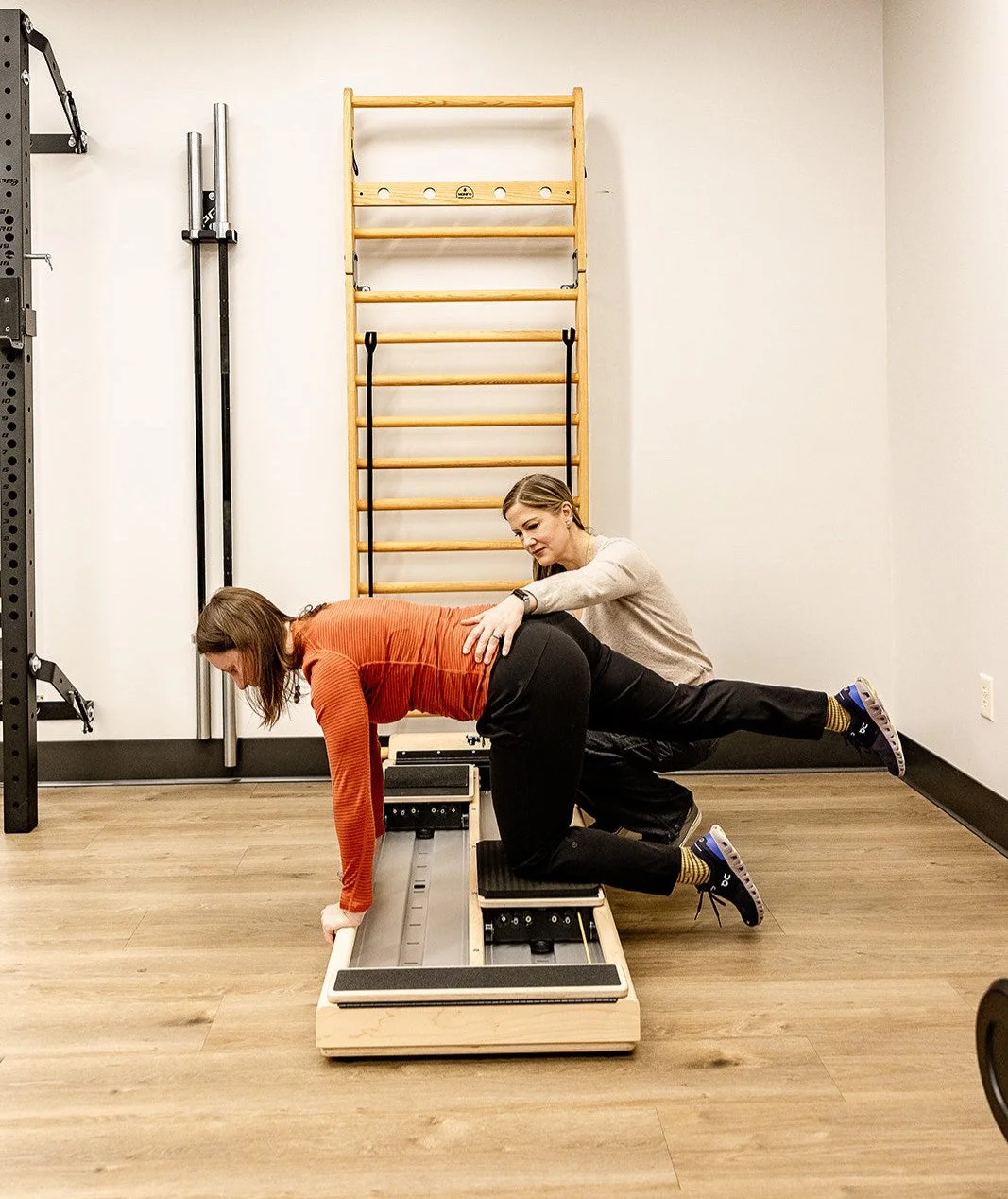 Bethany Hansen pelvic floor physical therapist helping patient with exercise